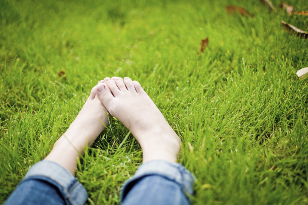 Bare Feet on Lush, Green Grass