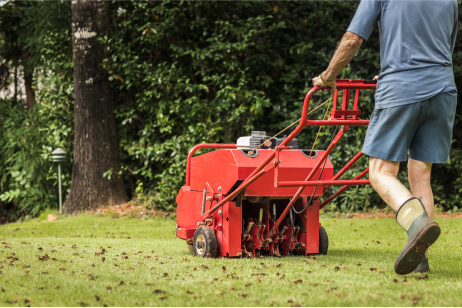 Lawn being prepped for spring with lawn aeration, soil testing, and winterizer
